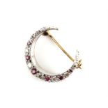 Ruby and diamond crescent brooch, set with round brilliant cut diamonds, estimated total diamond