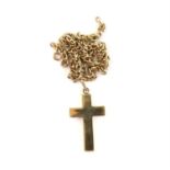 Large gold cross pendant, with an articulated bail, 5 x 2.5cm stamped 18 ct, on a flat curb link