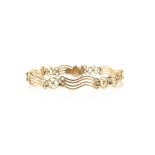 Antique gold fancy link bracelet, comprising of wave links and circular looped links,