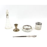 Silver collared perfume bottle, a silver candlestick and other silver topped/mounted items