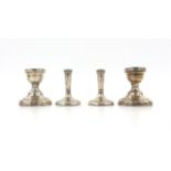 Two pairs of silver candlesticks, Birmingham 1907 and Birmingham 1902