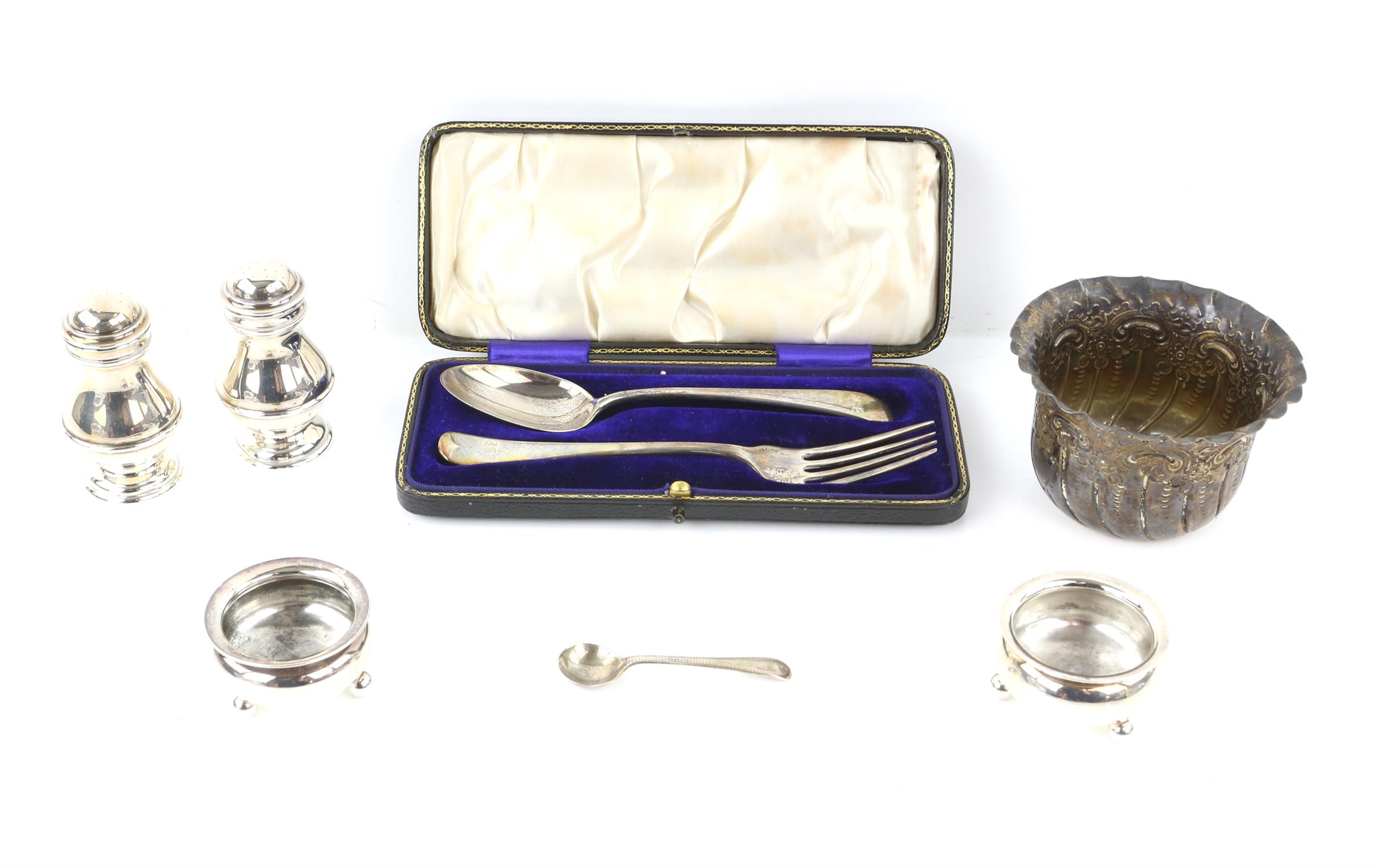 Pair of silver pepperettes, London 1935, pair of cauldron salts, Chester 1900, cased spoon and fork,