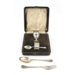 Three piece silver christening set to include egg cup, spoon and napkin ring in case,