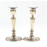 Pair of modern oval silver candlesticks, by D J Silver Repairs, London 1964, 21 cms high, loaded