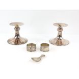 Pair of modern silver candle sticks by Mappin and Web, Sheffield 1998, serviette rings and a shell