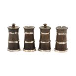 Four very similar walnut and silver mounted pepper grinders (two top screws although present