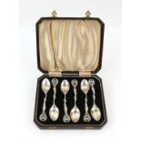 Risqué cased cast set of Victorian silver spoons with semi nude topless women holding wreaths