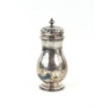 George V silver sugar caster with a band of engraved decoration and pierced cover by London 1929,