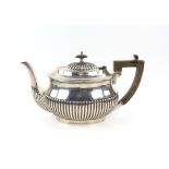 Edward VII half reeded silver teapot with ebonised handle and knob, London 1905, gross weight 569
