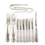 Various silver spoons, forks, knives, sugar tongs, serviette rings and a pill box,