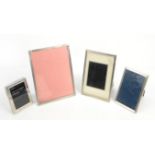 Three matched graduated silver photograph frames with engine turned decoration, by Sanders &