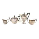 George V half reeded silver four piece tea and coffee service comprising teapot, coffee pot,