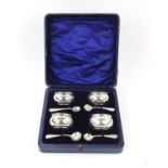 Edwardian cased set of four silver salts by J G, Birmingham 1906/07 with four silver spoons