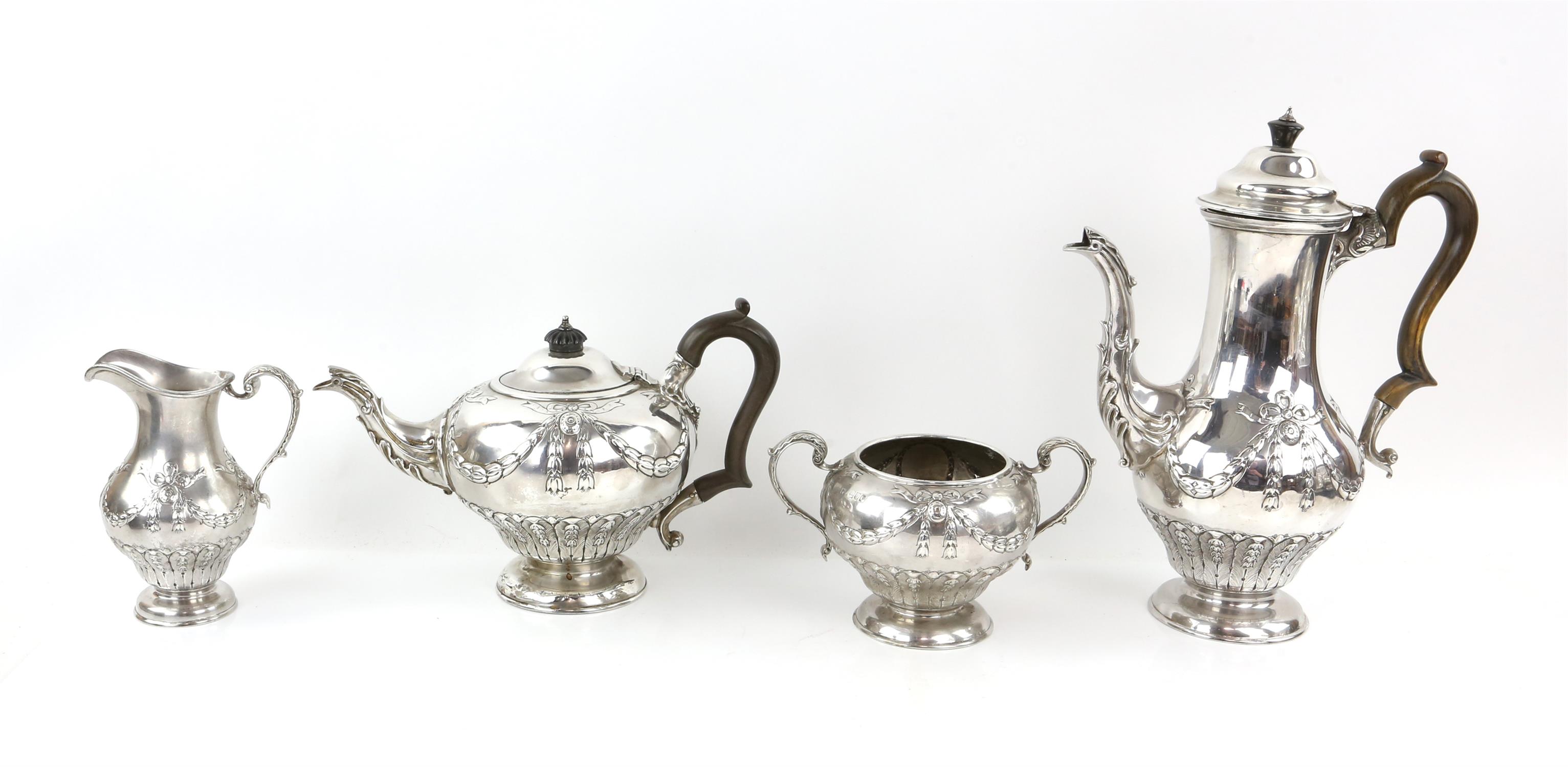 Victorian silver tea and coffee service with blank cartouches hung from ribbons and swags,