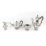 Victorian silver tea and coffee service with blank cartouches hung from ribbons and swags,