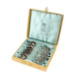 Boxed set of twelve Swedish silver spoons with organic form stem to finials, by GEWE, Stockholm,
