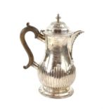 George III silver jug by John Emes, London 1798,half reeded decoration the cover with urn finial,