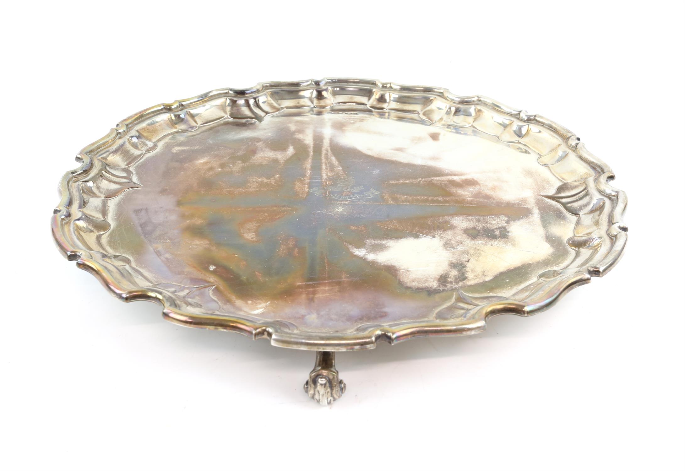 George V silver salver with shaped border on scroll feet, by John Round & Son, Sheffield 1929,