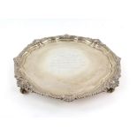 Silver presentation salver by Goldsmiths and Silversmiths company, with shell and foliate scroll