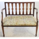 Early 20th century two seater settee with shell patera to splat back, having floral upholstered