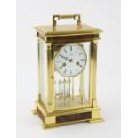 W Widdop brass cased four glass mantle clock striking the hours and half hours on two bells, H27cm