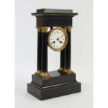 19th century ebonised and gilt metal mounted portico clock, the white enamel dial with Roman