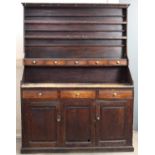 19th century pine dresser, having plate rack above three mahogany fronted drawers over three