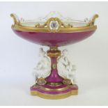 Late 19th/early 20th century Continental porcelain figural centrepiece, the oval bowl with puce