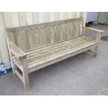 Weathered teak garden bench of slat construction, h87cm w191.5cm d61cm