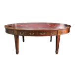 20th century mahogany oval library table with tooled red leather writing surface two drawers to