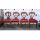 Set of six Biedermeier walnut and ebonised dining chairs with carved and shaped splat backs,