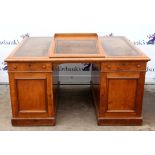 Victorian oak pedestal desk, the top with gilt tooled leather writing surface and raised writing
