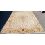 Large cream ground Agra carpet, stylised floral motifs on a cream ground within border with
