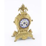 Early 20th century French brass mantle clock with enamel dial, the two train movement striking on a