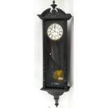 Vienna regulator style wall clock, the black painted case with arched pediment and urn finial above
