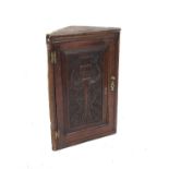 19th century oak corner cupboard with tulip carved panelled door, h91cm x w59cm x d29cm,