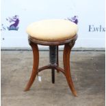 19th century rosewood effect adjustable piano stool with brass decoration on three supports,