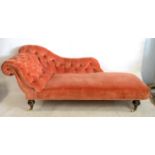 Victorian chaise longue button back in salmon pink upholstery, turned feet to casters 84.5cmh,