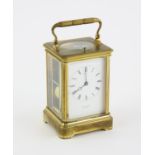 Early 20th century French brass carriage clock repeating on a gong, the white enamel dial with
