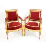 Pair of Empire style giltwood open armchairs, with red and gilt stuffover upholstery