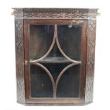 19th century wall hanging oak glazed cabinet with dentil cornice above blind fret work frieze,