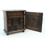 18th/19th century oak and mahogany table top cabinet with arrangement of 8 drawers,