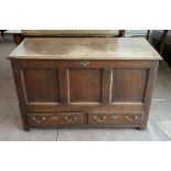 19th century oak mule chest, with hinged top over a panelled front and two drawers on square feet,