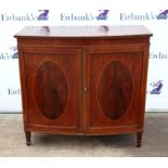 Georgian style mahogany bow front cupboard with boxwood inlay, two doors enclosing two slides on