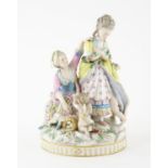 AMENDED DESCRIPTION Late 19th century Dresden figural group of two women with Eros and a putto,