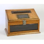 Early 20th century oak letter box, the sloping top with brass framed posting slot worded 'Letters',