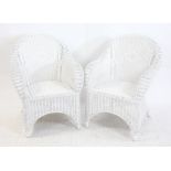 Pair of modern white painted wicker armchairs, on splayed legs, h88cm w67cm