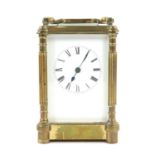 Brass carriage clock with reeded column corners, 8 day striking lever movement, 14 cms high