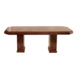 Art Decco burr walnut veneered two pedestal dining table, the well figured top with canted corners,