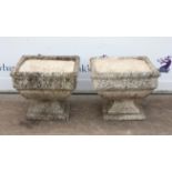 Pair of reconstituted stone planters on stepped square bases, h41.5cm w50cm d50cm